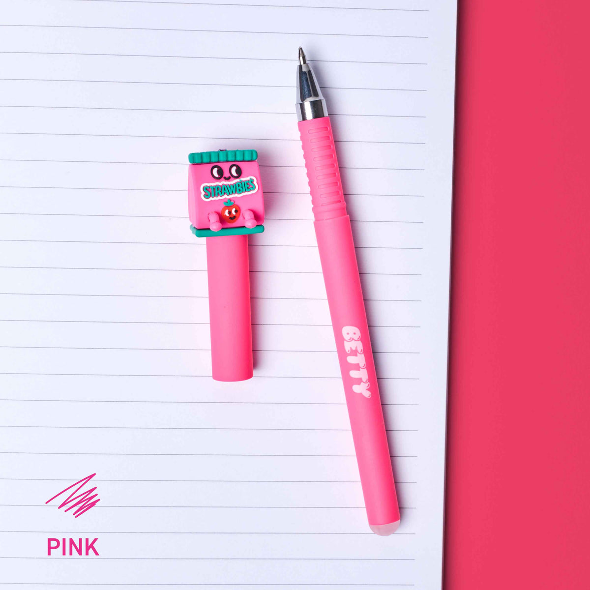 Pink pen with cartoon character on a lined notebook page