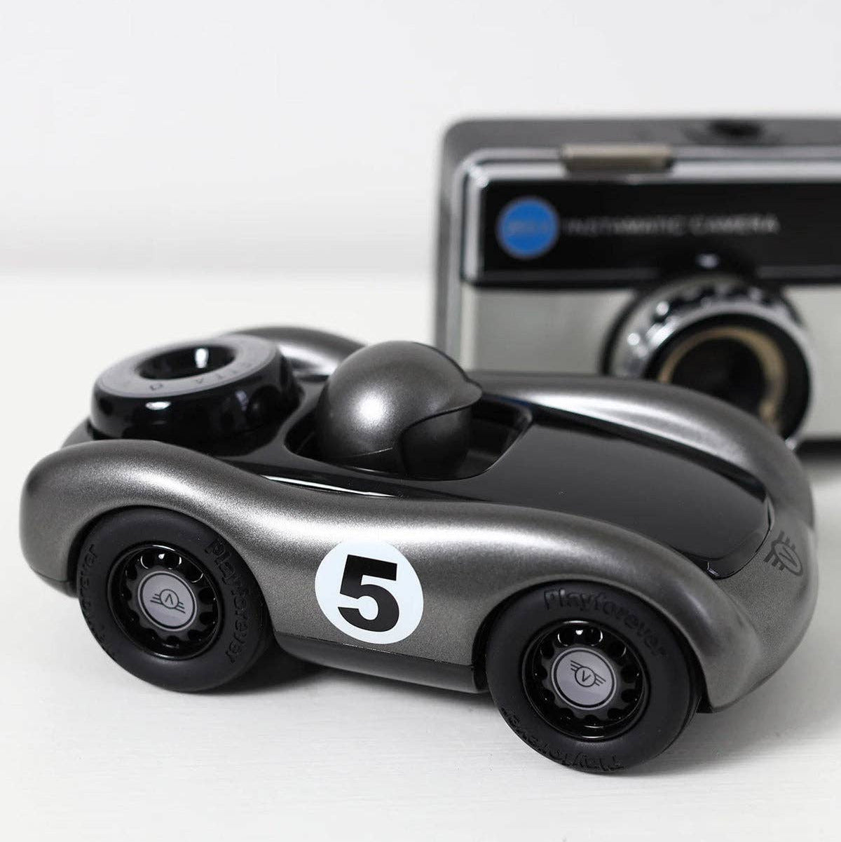 Toy car with number 5 on a white background