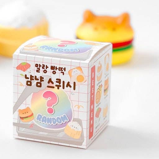 Colorful packaging of a squishy toy with Korean text and a question mark design.