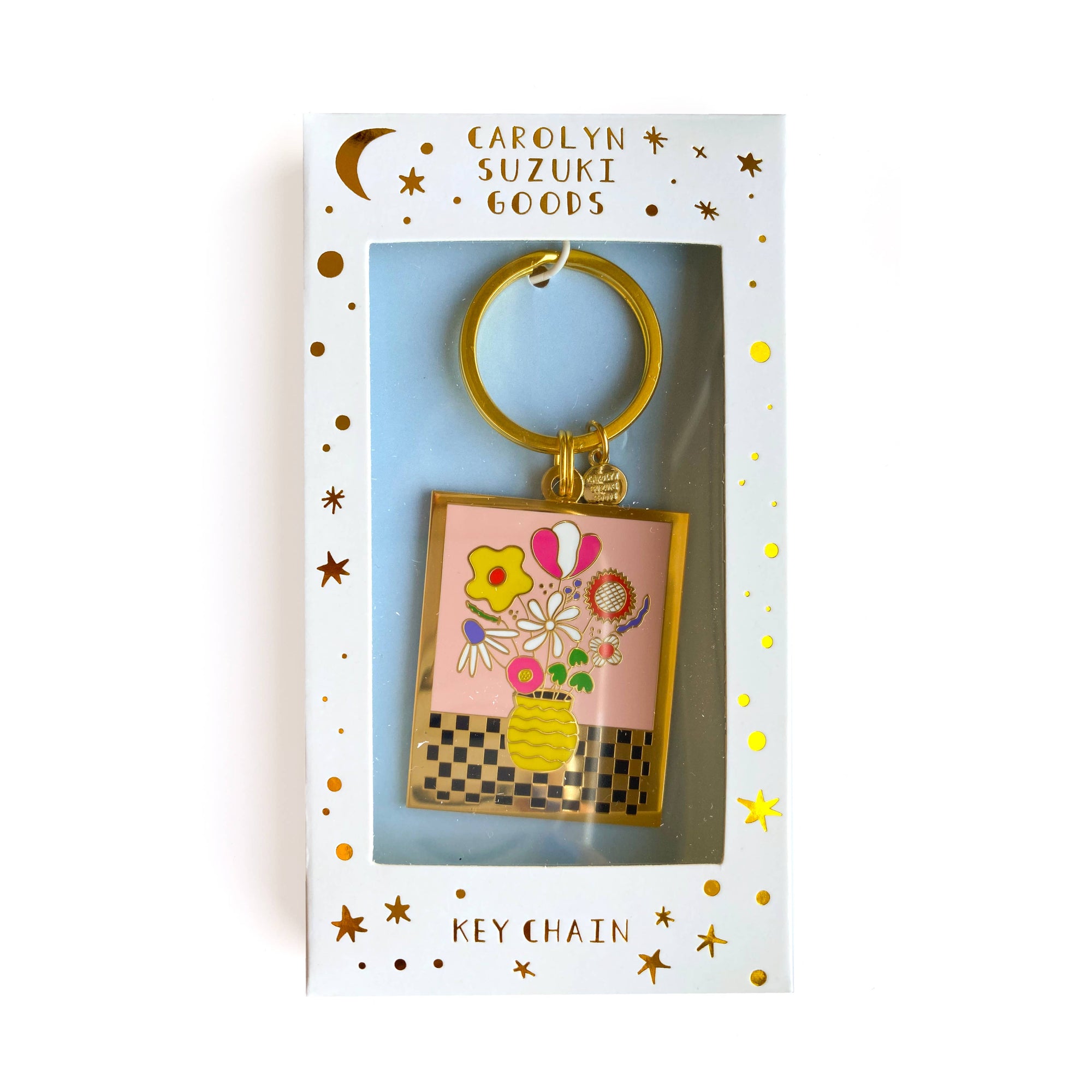 Keychain in packaging with 'Carolyn Suzuki Goods' branding