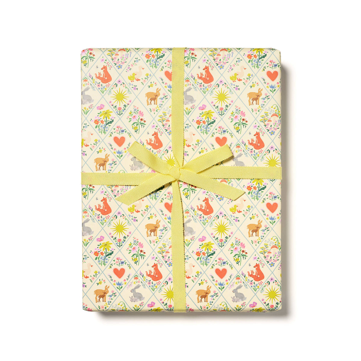 Gift box with a floral pattern and yellow ribbon on a white background