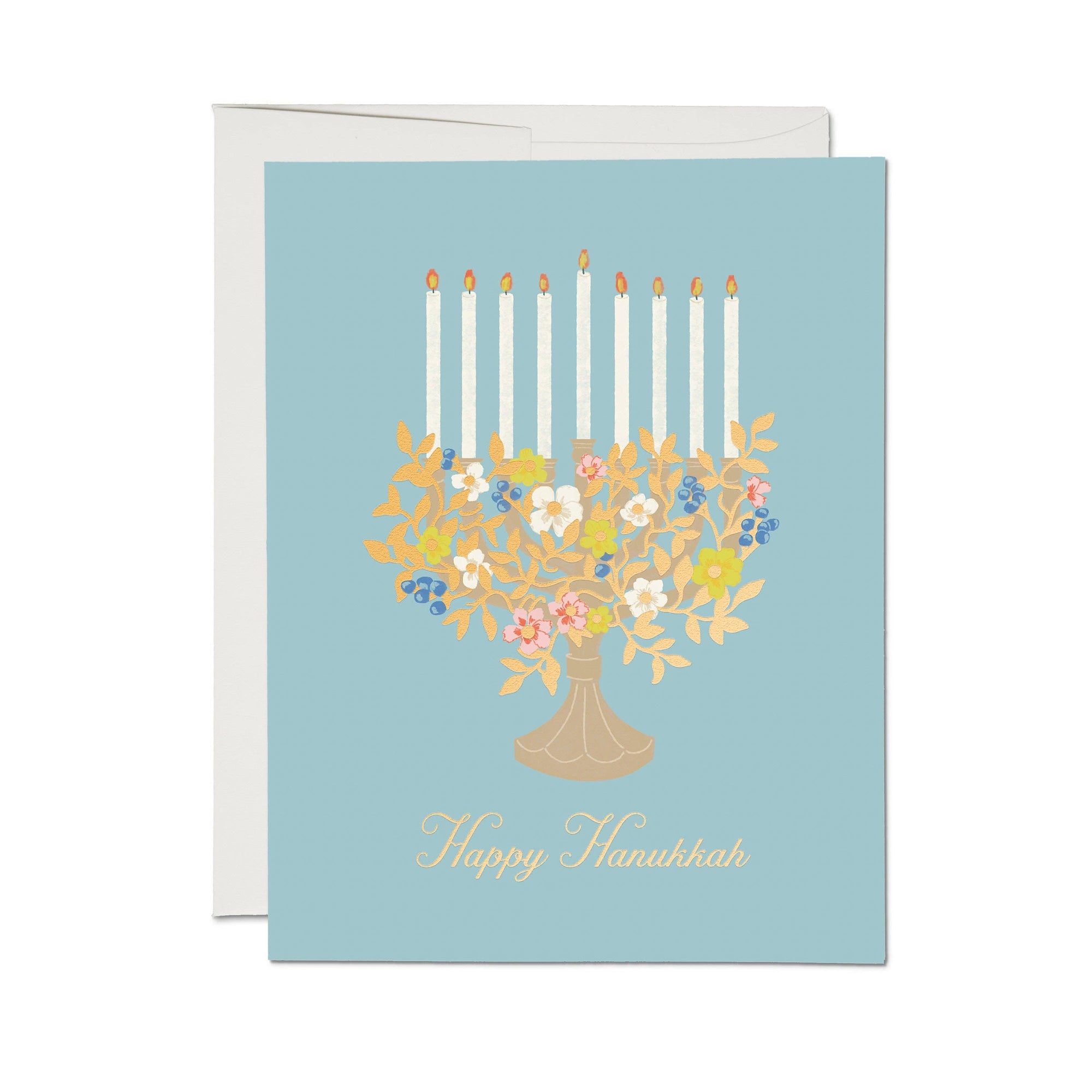 Greeting card with floral menorah design and 'Happy Hanukkah' text on a light blue background.