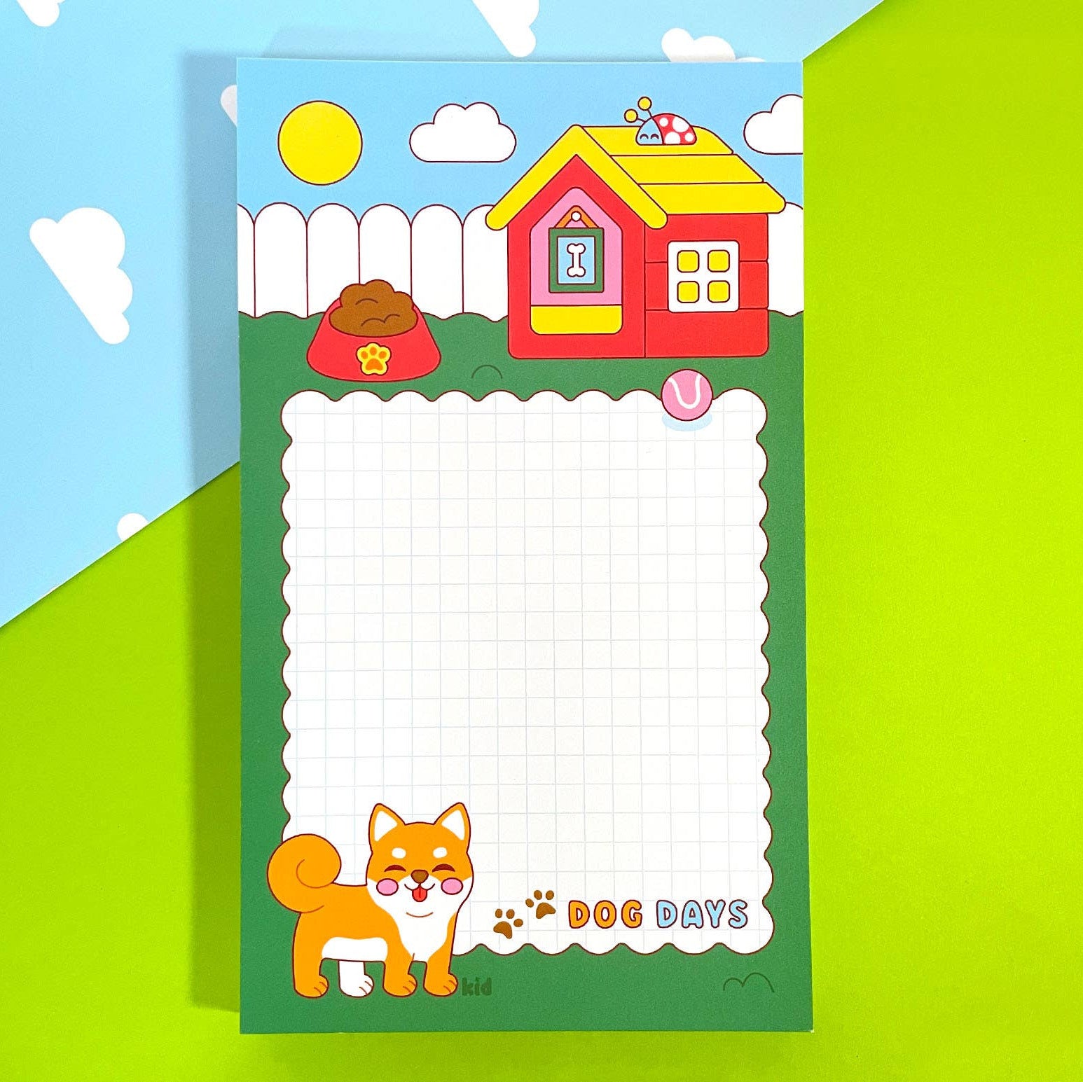 Children's notepad with a cartoon dog and house design on a colorful background