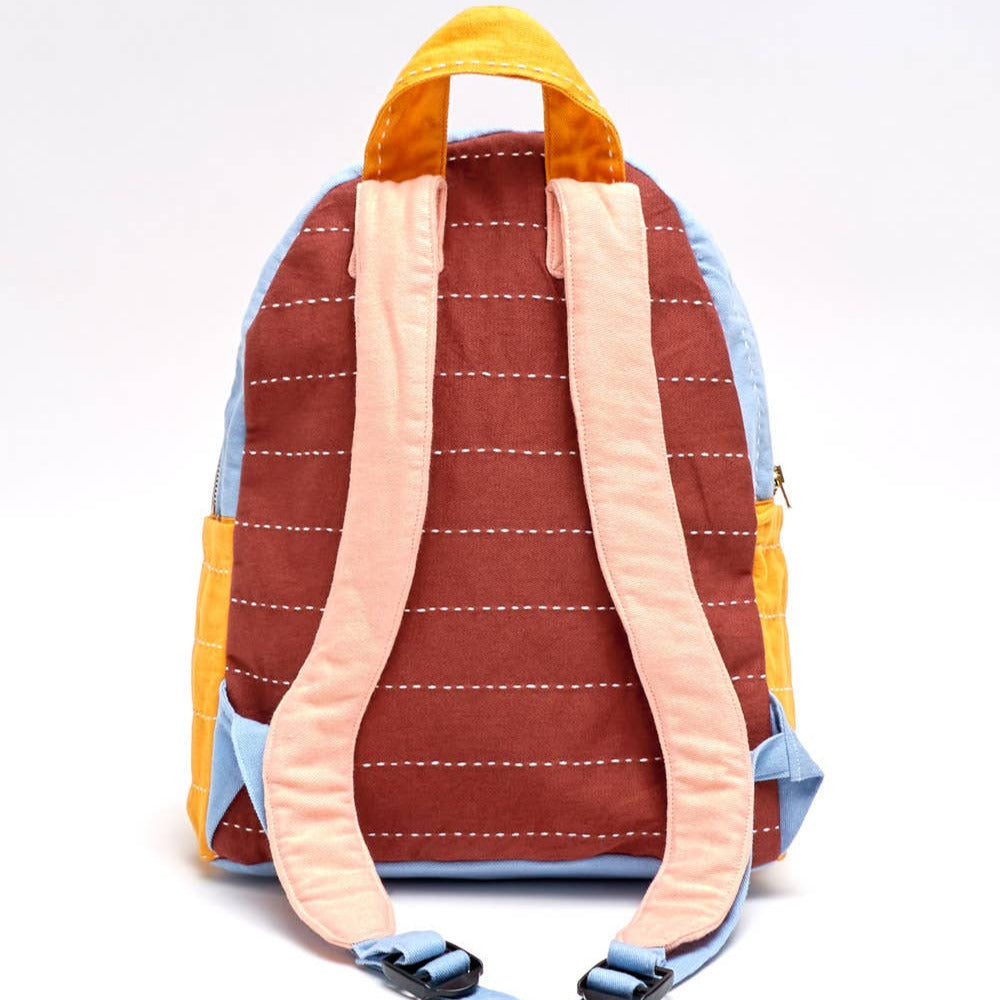 Multicolored backpack with pink straps on a white background