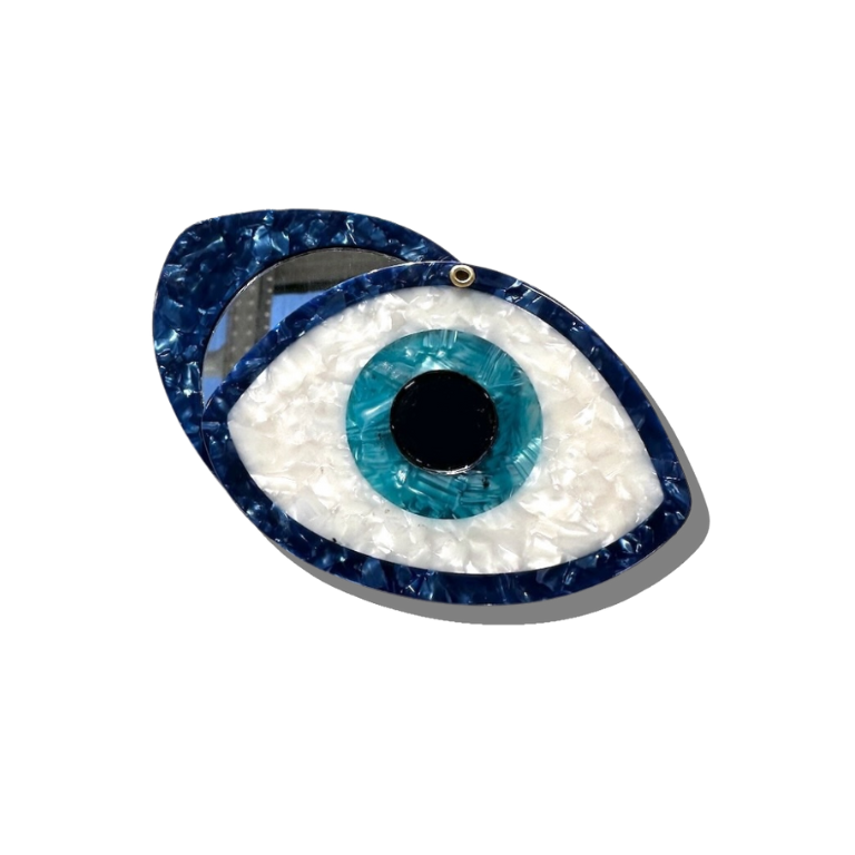 Decorative eye-shaped object with blue and white design on a white background