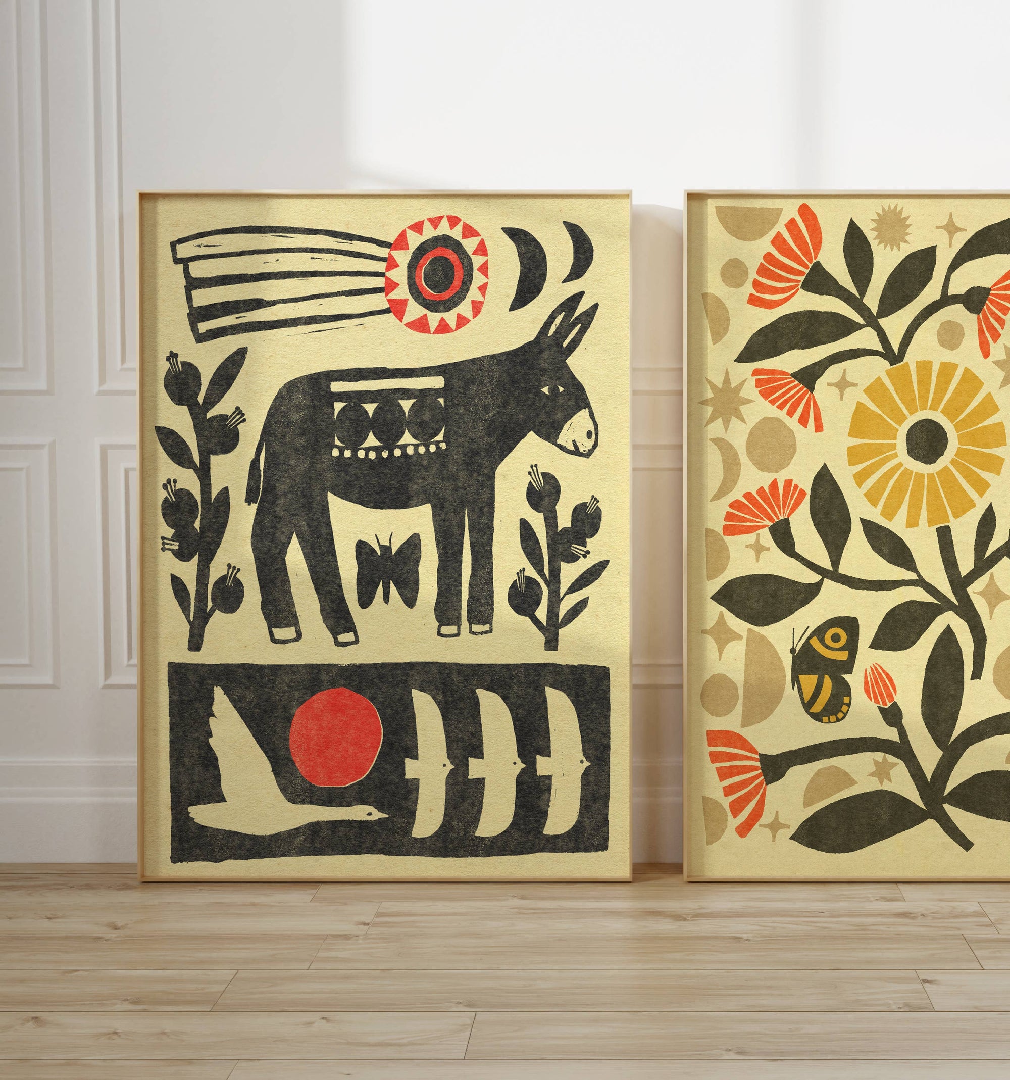 Two abstract art pieces on a wall with a donkey and floral designs.