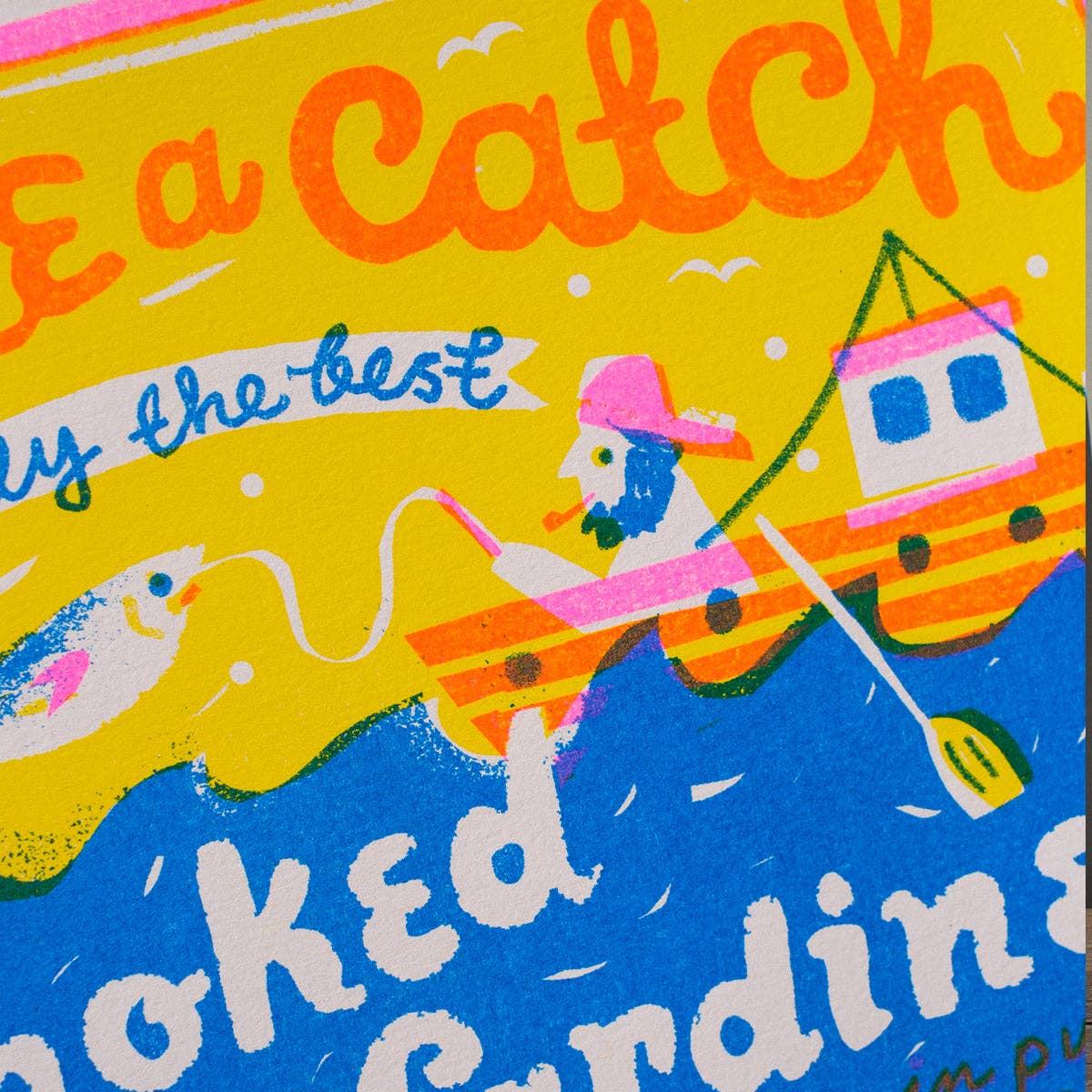 Print with a colorful illustration of a fisherman and text on a yellow and blue background.