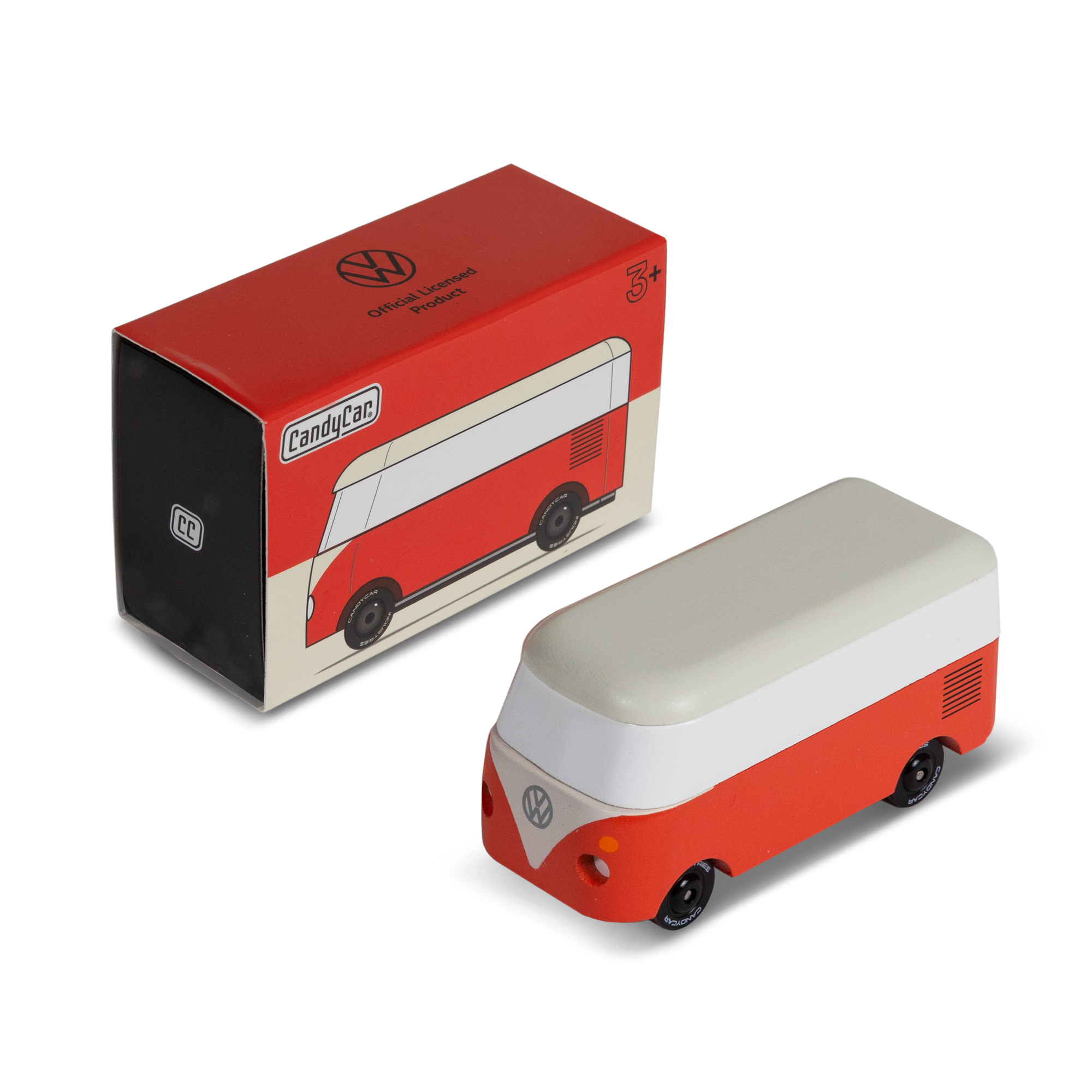 Red and white model van next to its packaging on a white background