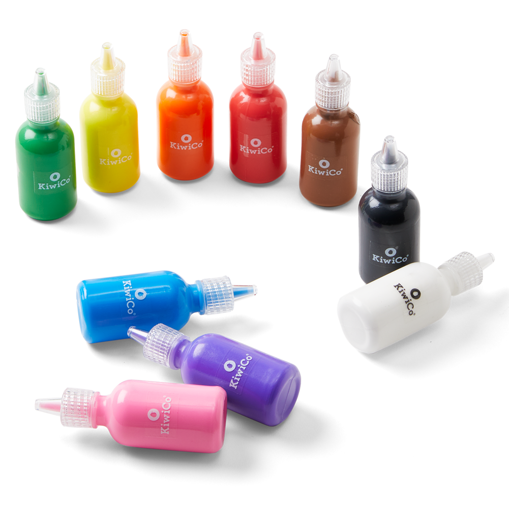A set of small plastic ink or paint bottles with dropper-style caps, shown on a white background. The bottles include green, yellow, orange, red, brown, black, blue, purple, pink, and white, with several bottles lying on their sides and three standing upright.
