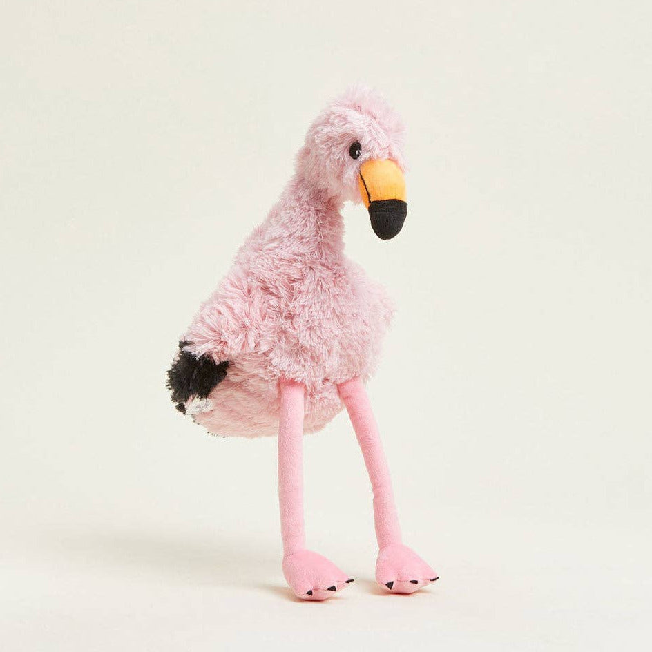 Pink plush flamingo toy on a light gray background