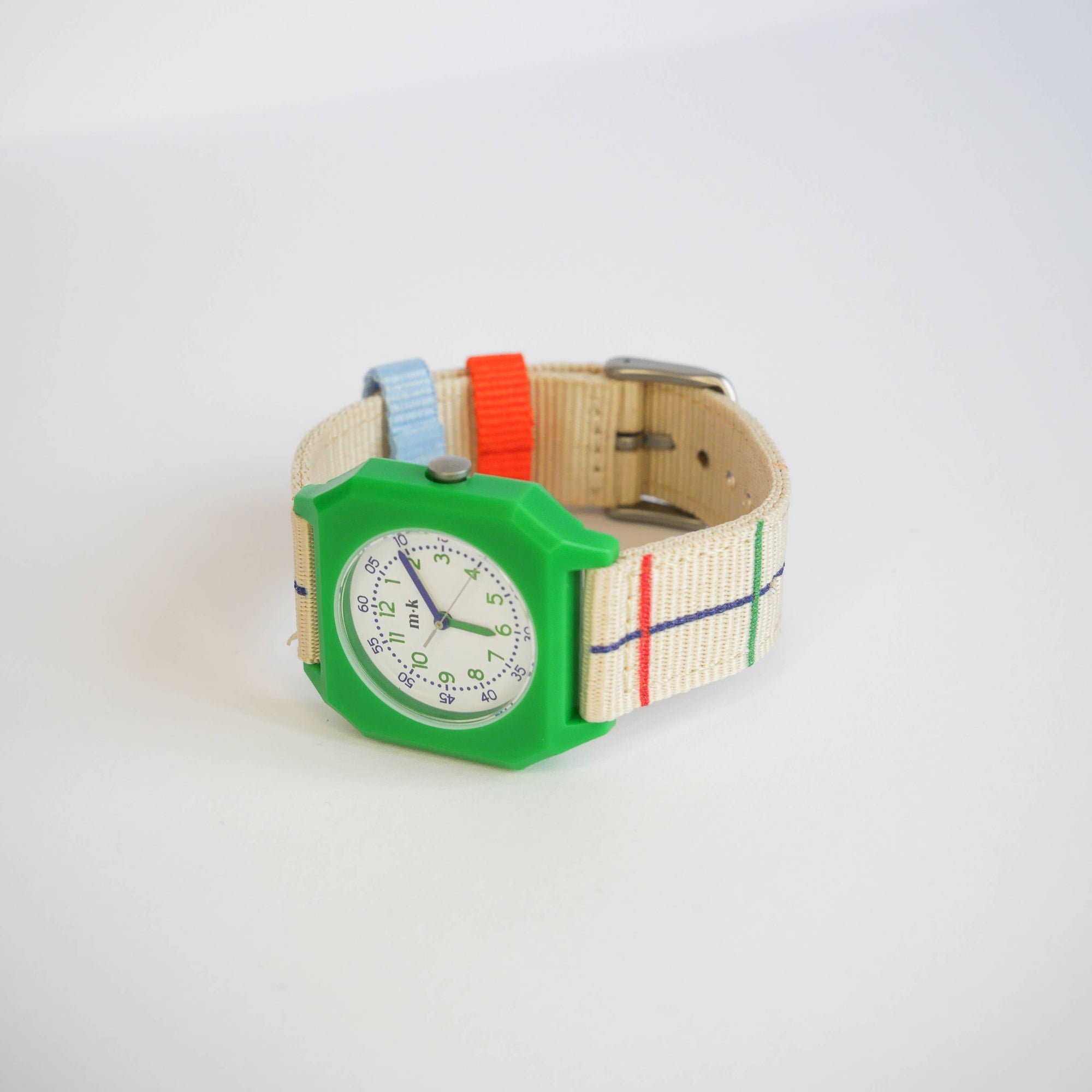 Colorful watch with a green case and multicolored strap on a white background