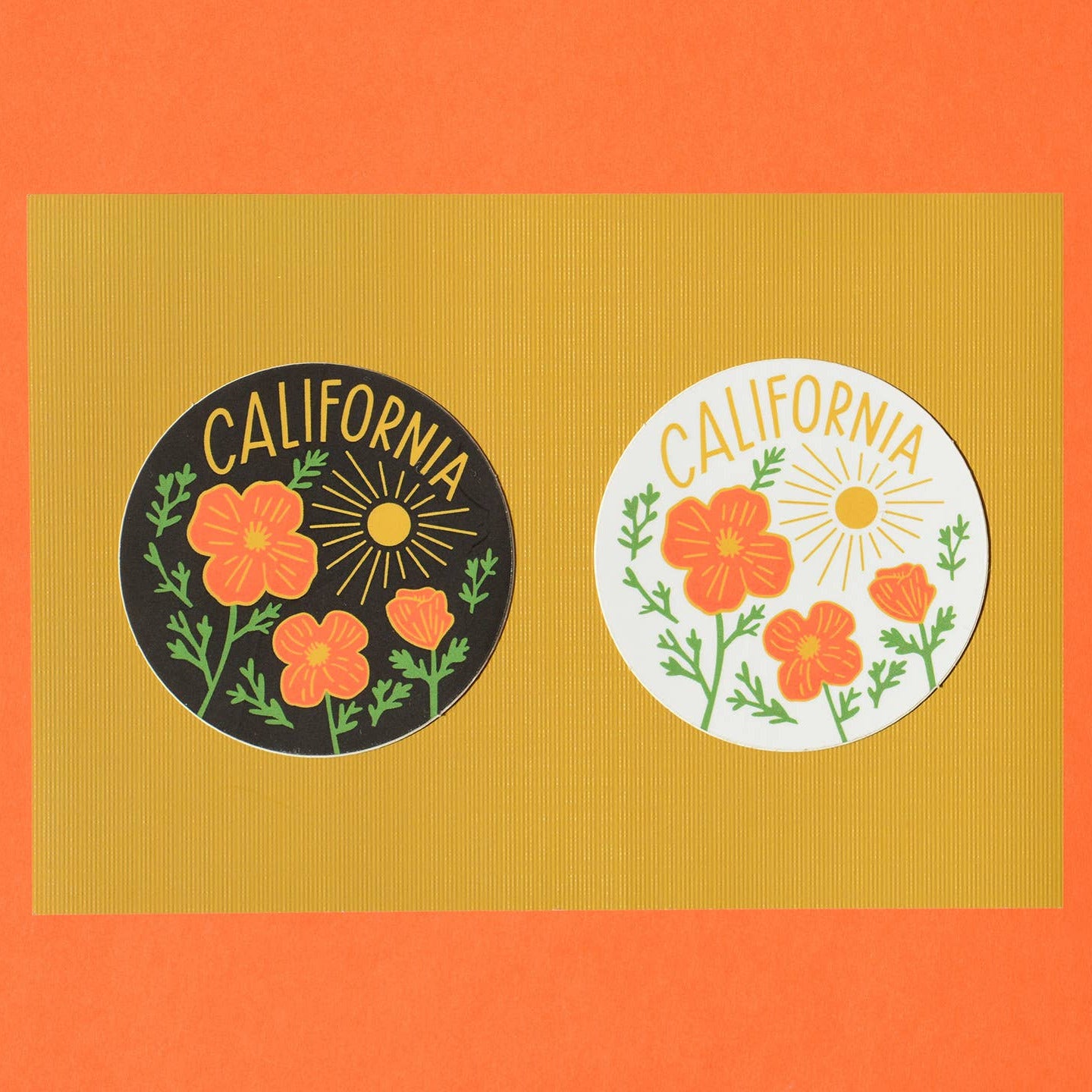 Two 'California' themed stickers with floral designs on a textured orange background.