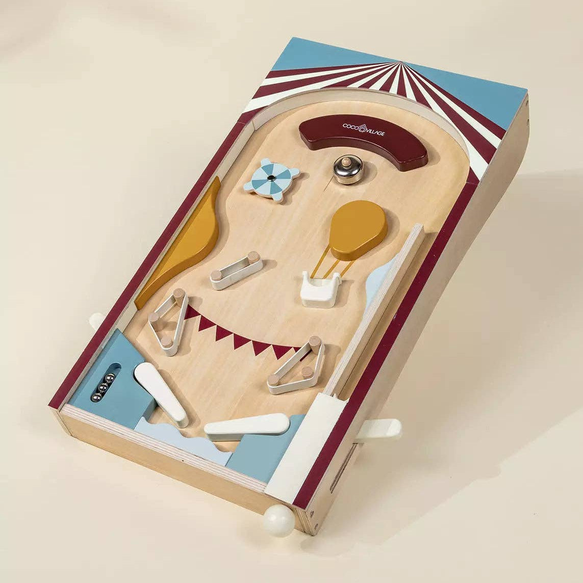 Wooden toy set with accessories in a box on a beige background