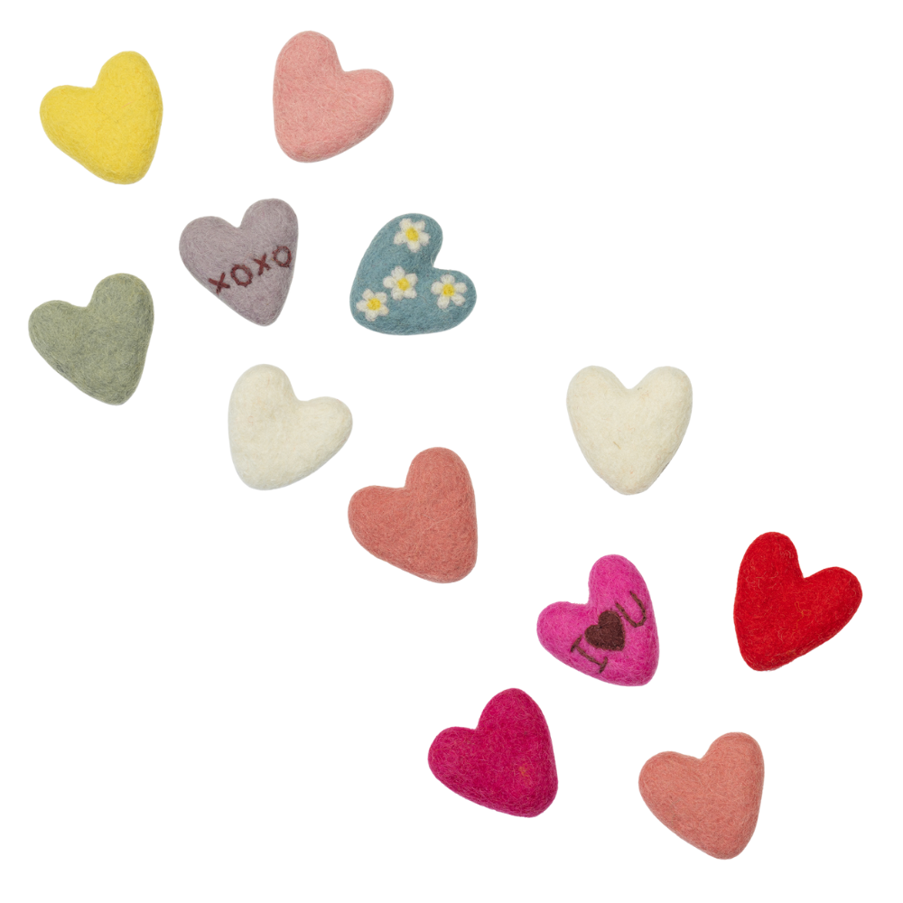 Colorful heart-shaped buttons on a white background