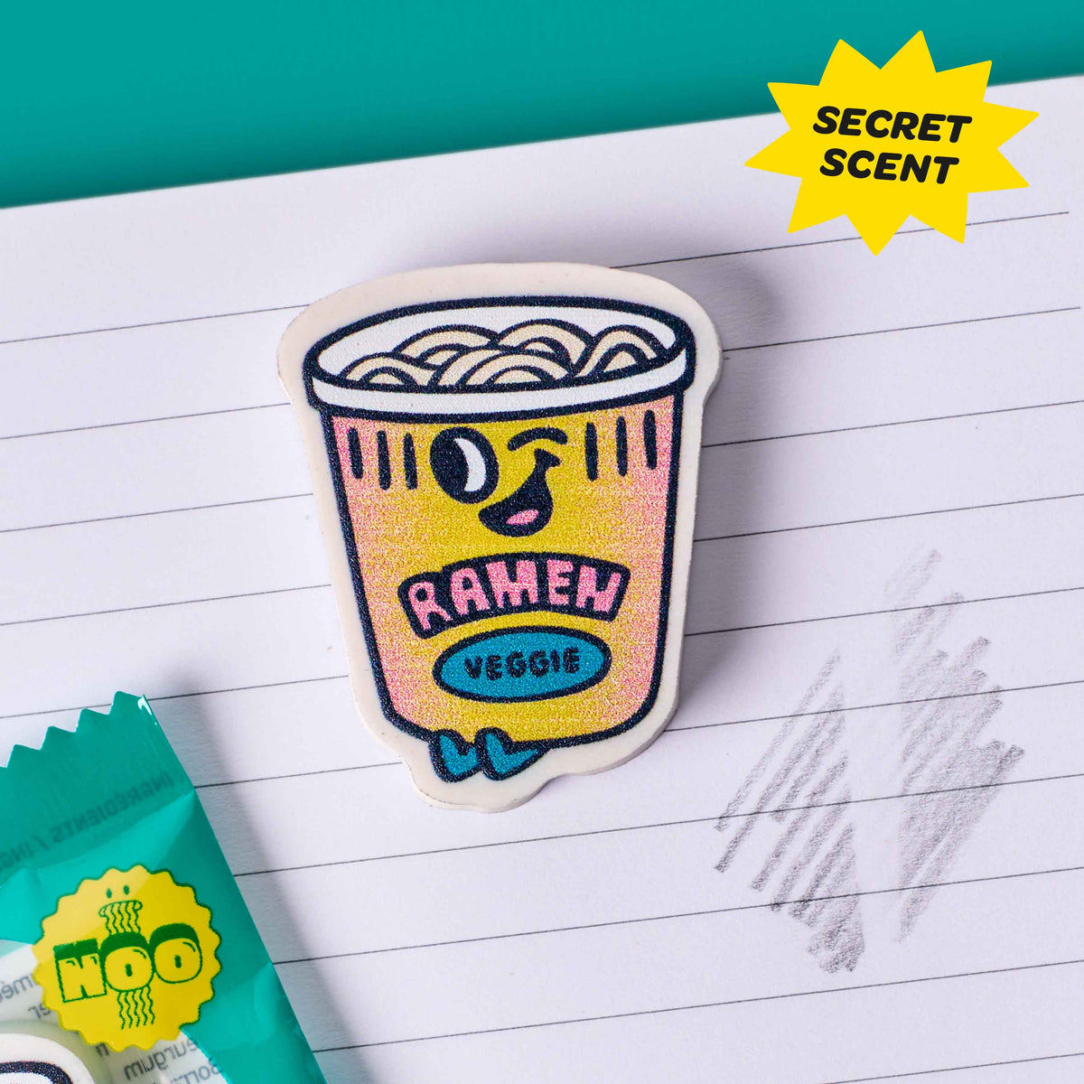 Sticker of a ramen cup on lined paper with 'Secret Scent' text.