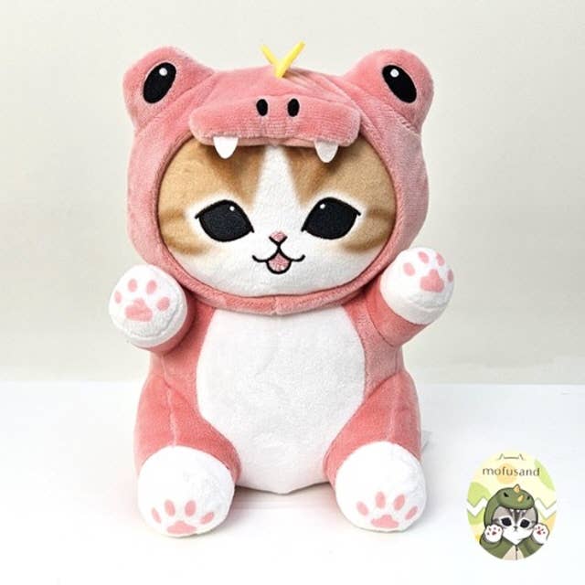 Plush toy of a cat in a pink costume with a white background
