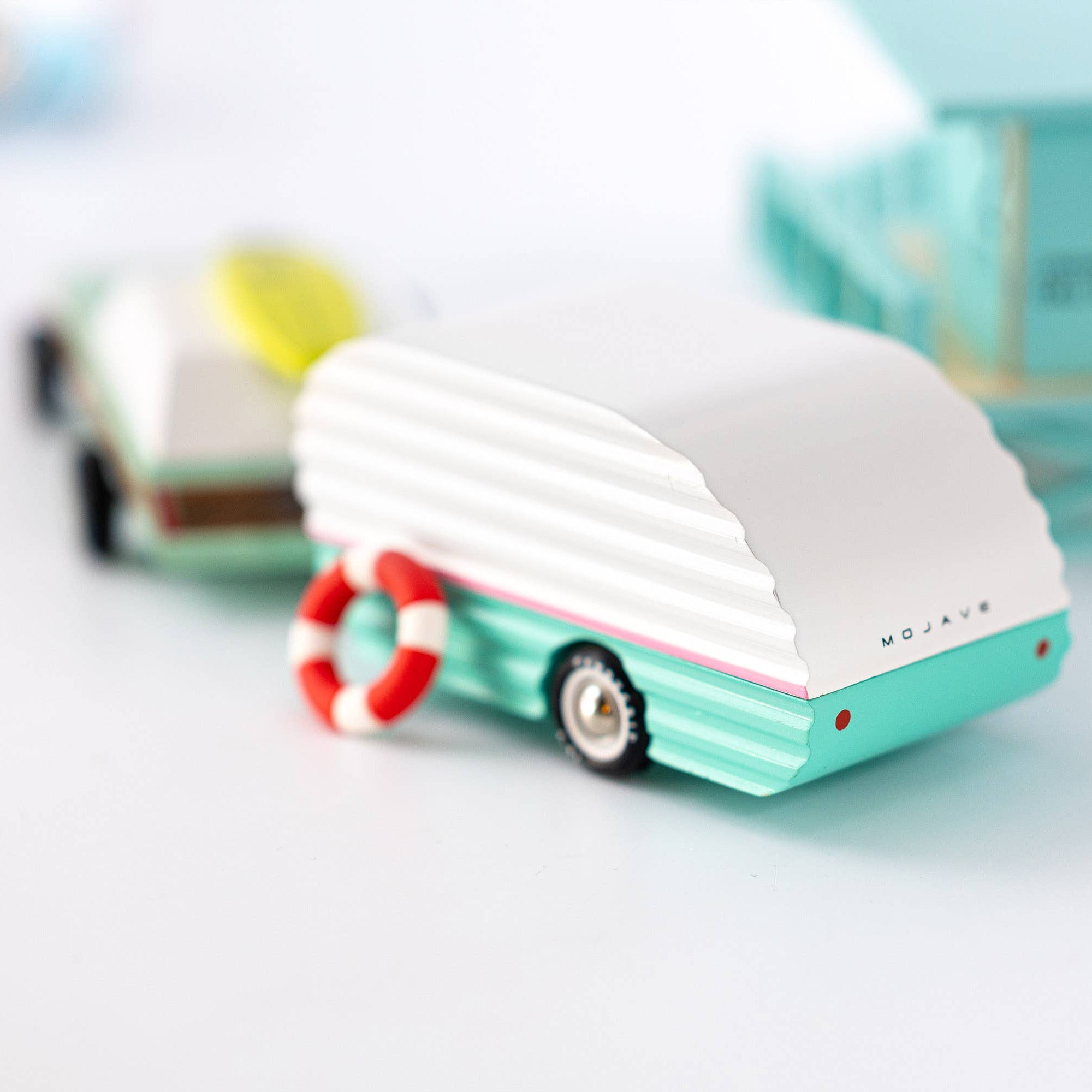 Small model of a trailer with a life buoy on a white background