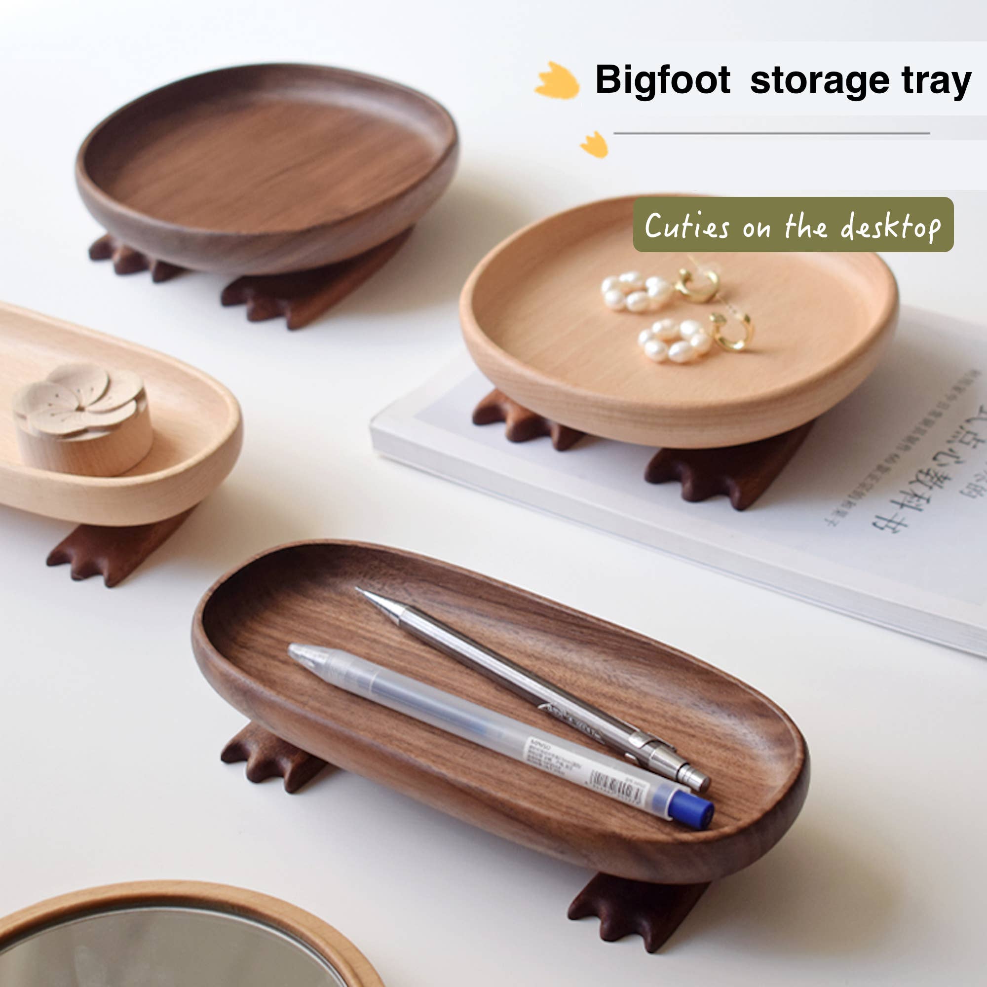 Wooden storage trays with animal-like feet on a white surface, labeled 'Bigfoot storage tray'.