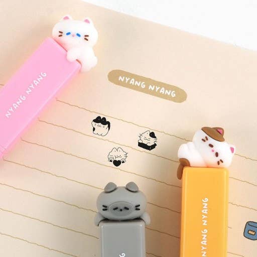 Set of cute animal-shaped stationery items with 'NYANG NYANG' branding on a notebook background.