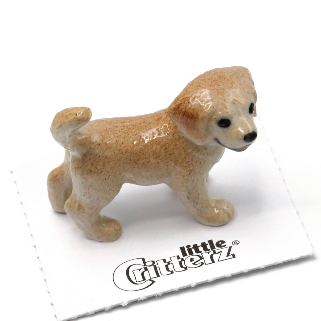 Small brown dog figurine on a white card with 'little Critterz' branding.