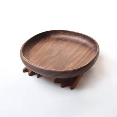 Wooden plate with a stand on a white background