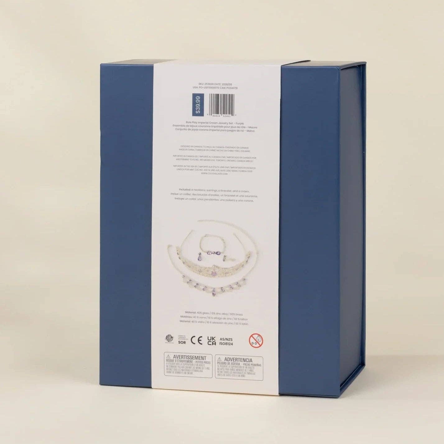 The back of a blue jewelry gift box with a white paper insert showing product details, photographed on a plain light beige background.