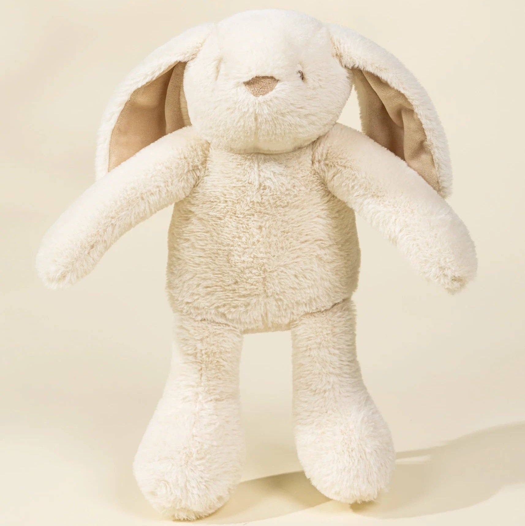 Beige plush bunny toy on a beige background