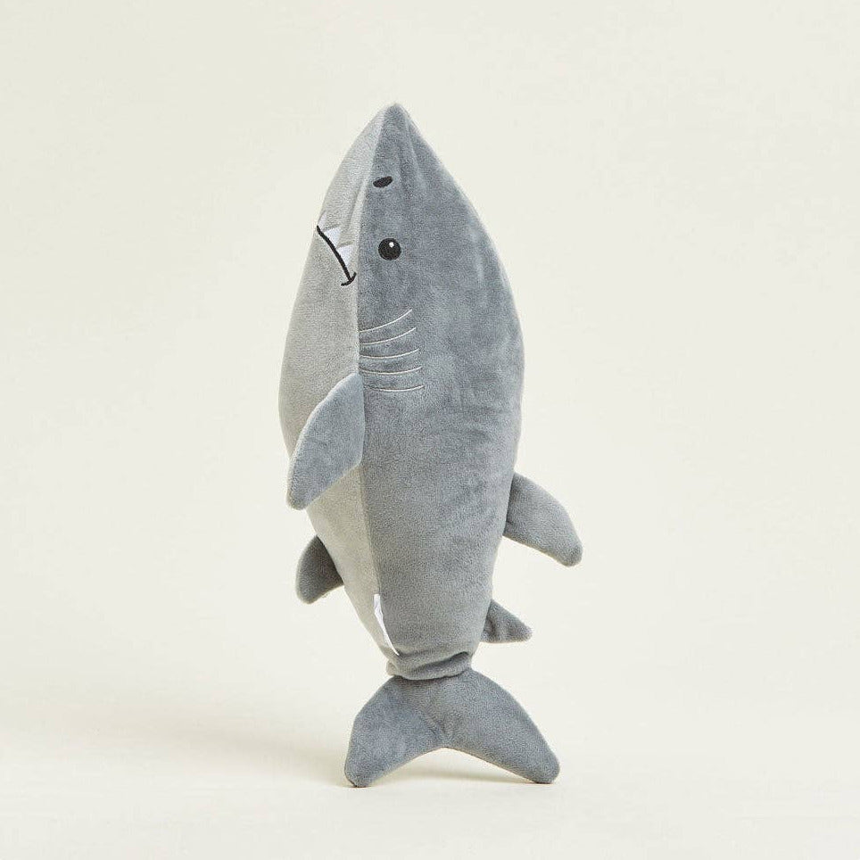 Gray shark plush toy on a white background