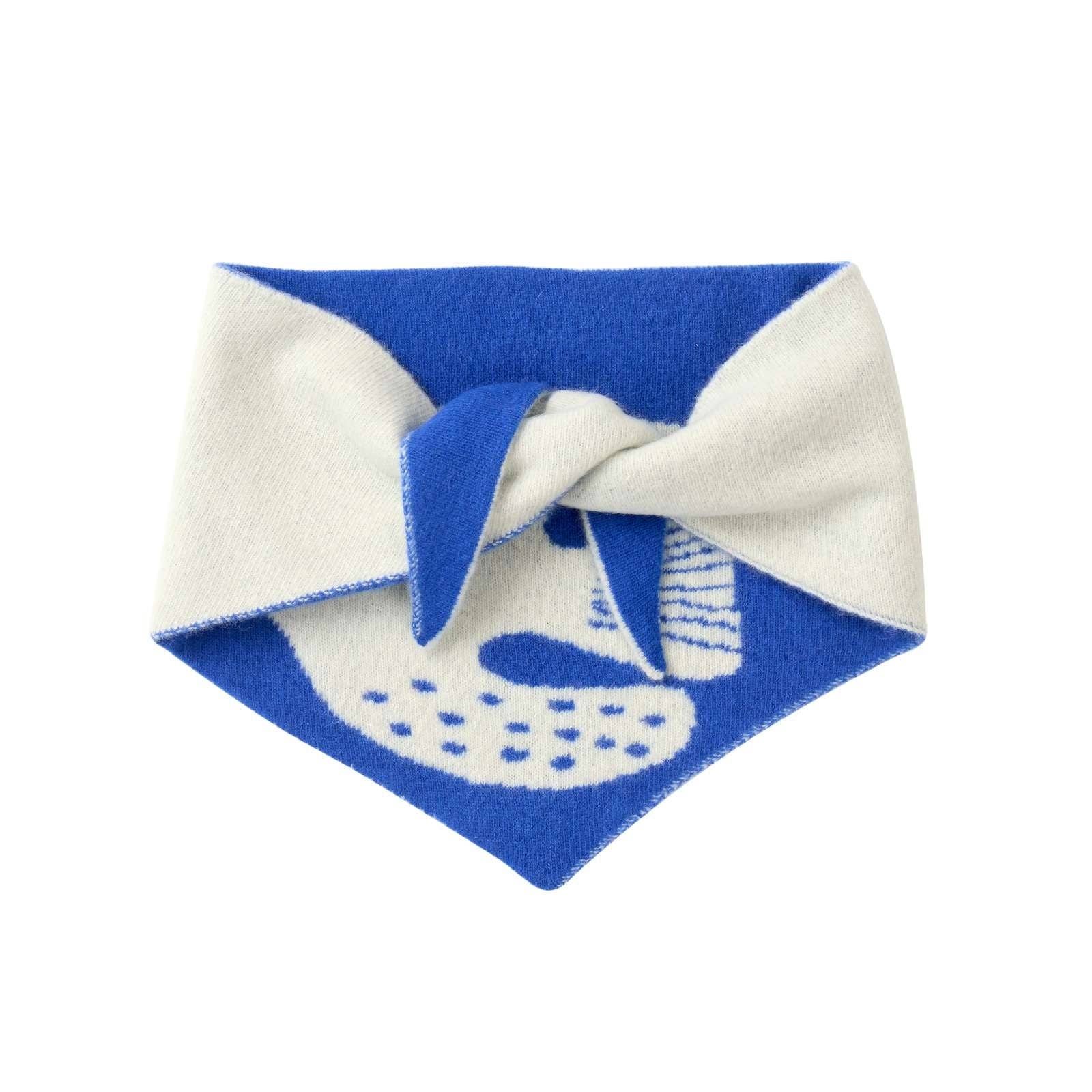 Blue and white patterned fabric with a knot on a white background