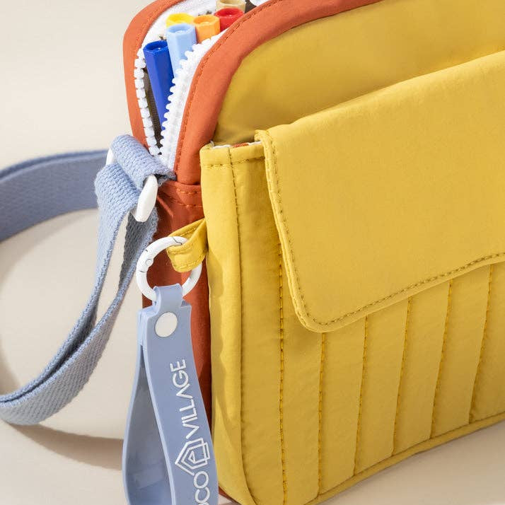 Multicolored pouch with a visible brand tag on a beige background