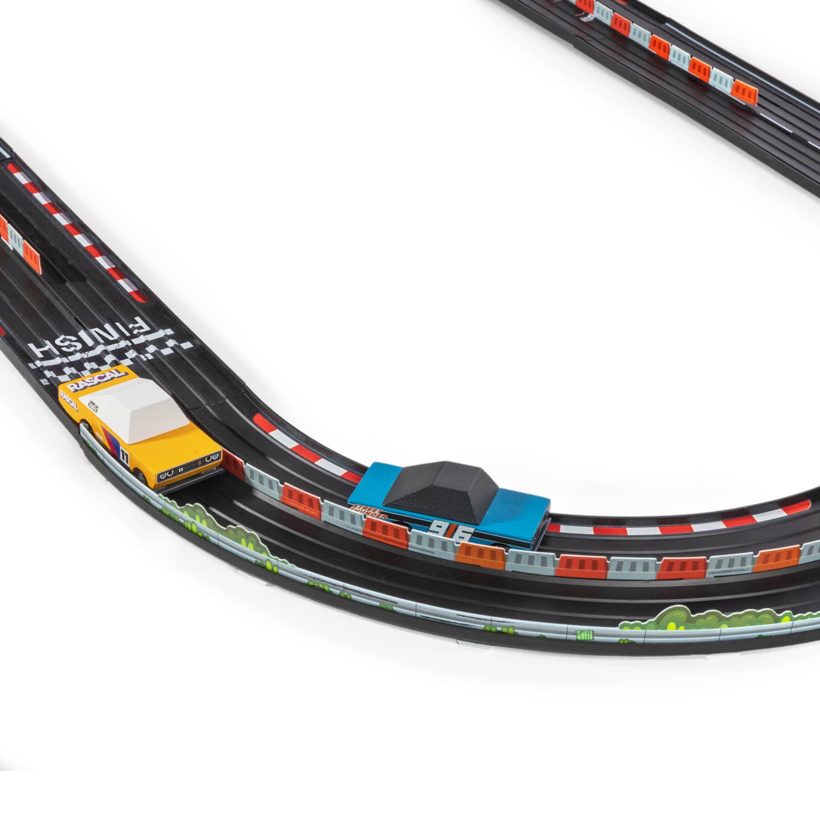 Toy race track set with a car on a white background
