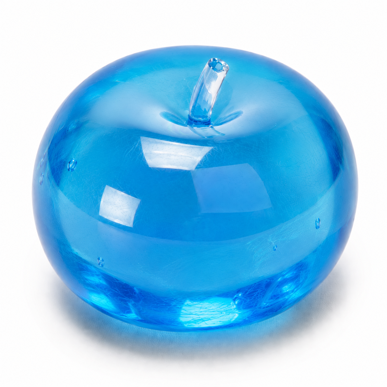 Blue glass apple-shaped object on a white background