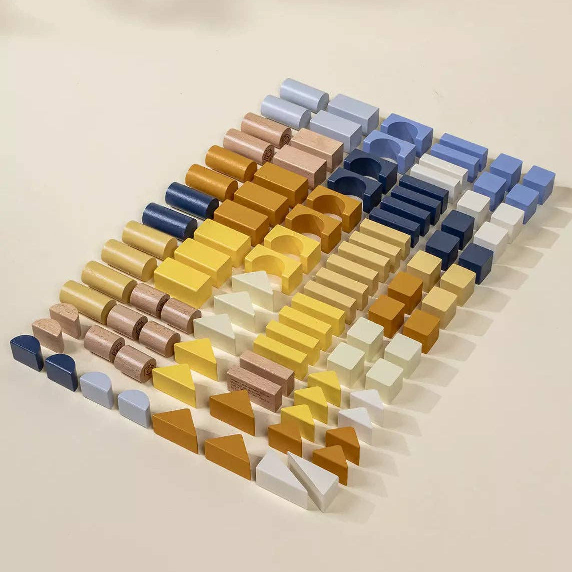 blocks with geometric shapes in various colors on a beige background