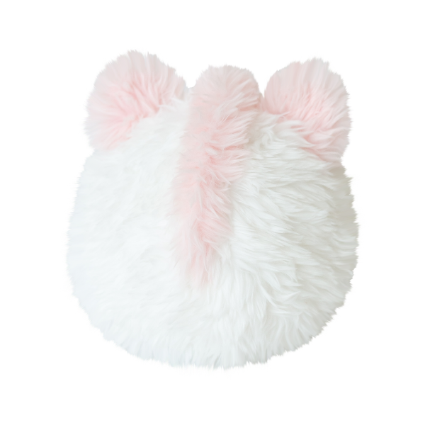 Fluffy white and pink pillow with a heart shape on a white background