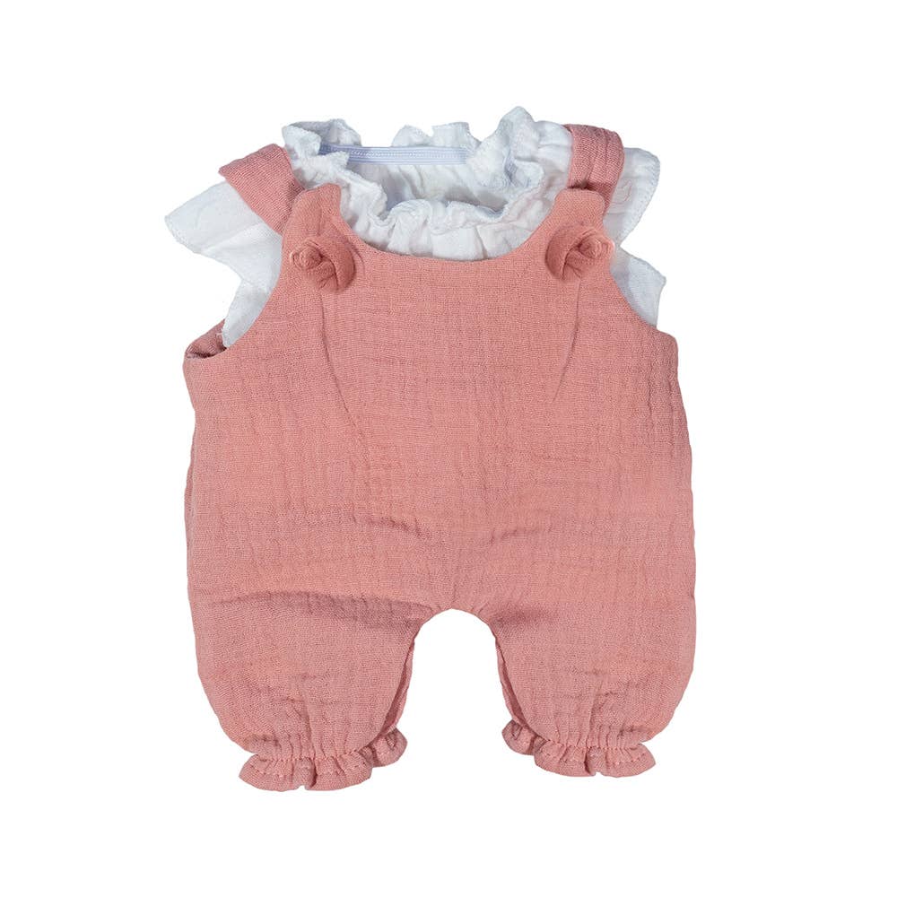 Pink dolls romper with ruffled white top on a white background