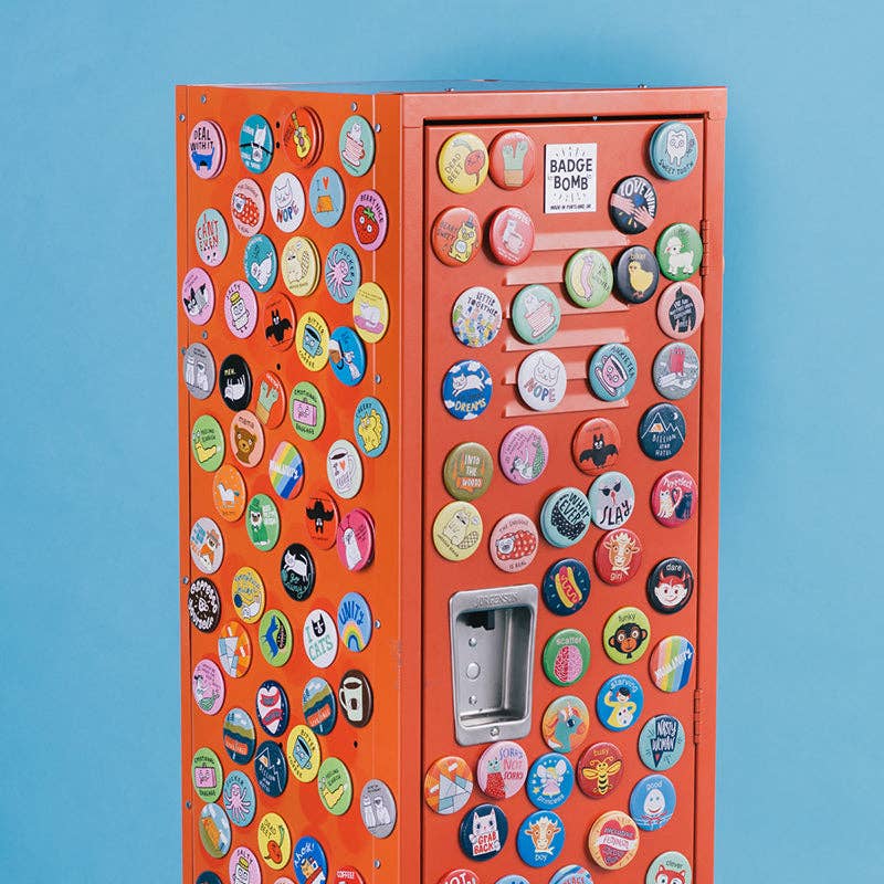Vending machine covered in colorful buttons against a blue background