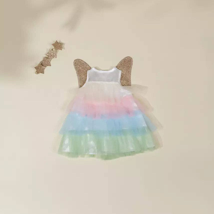doll rainbow dress with butterfly wings on a beige background