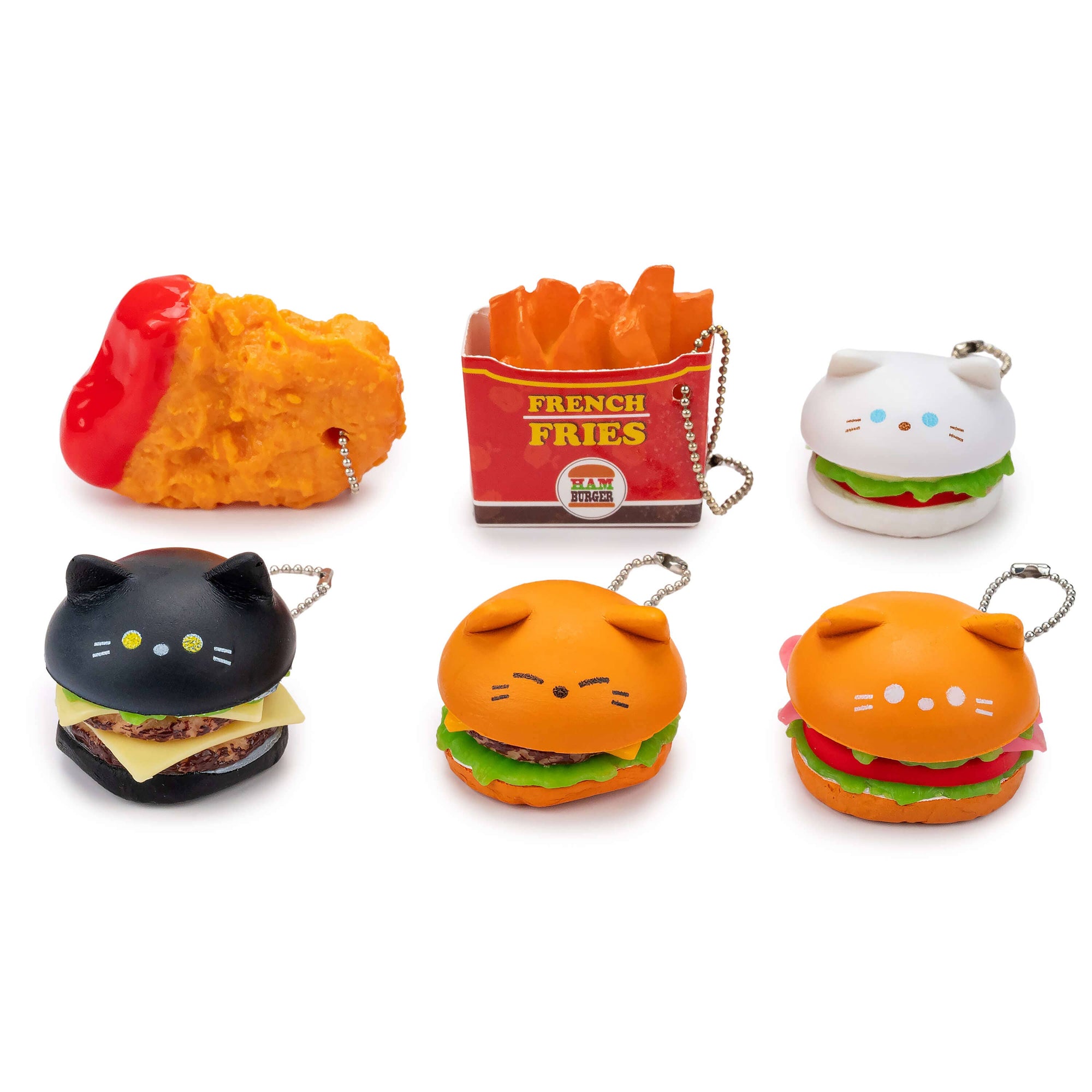 Set of cute keychains shaped like burgers, fries, and a cat on a white background