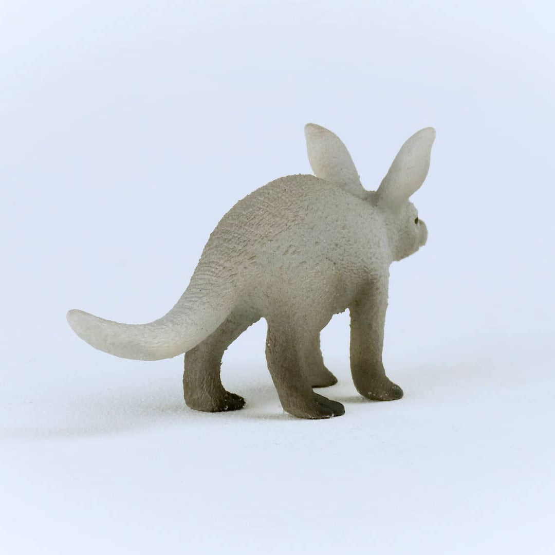Gray aardvark figurine on a white background