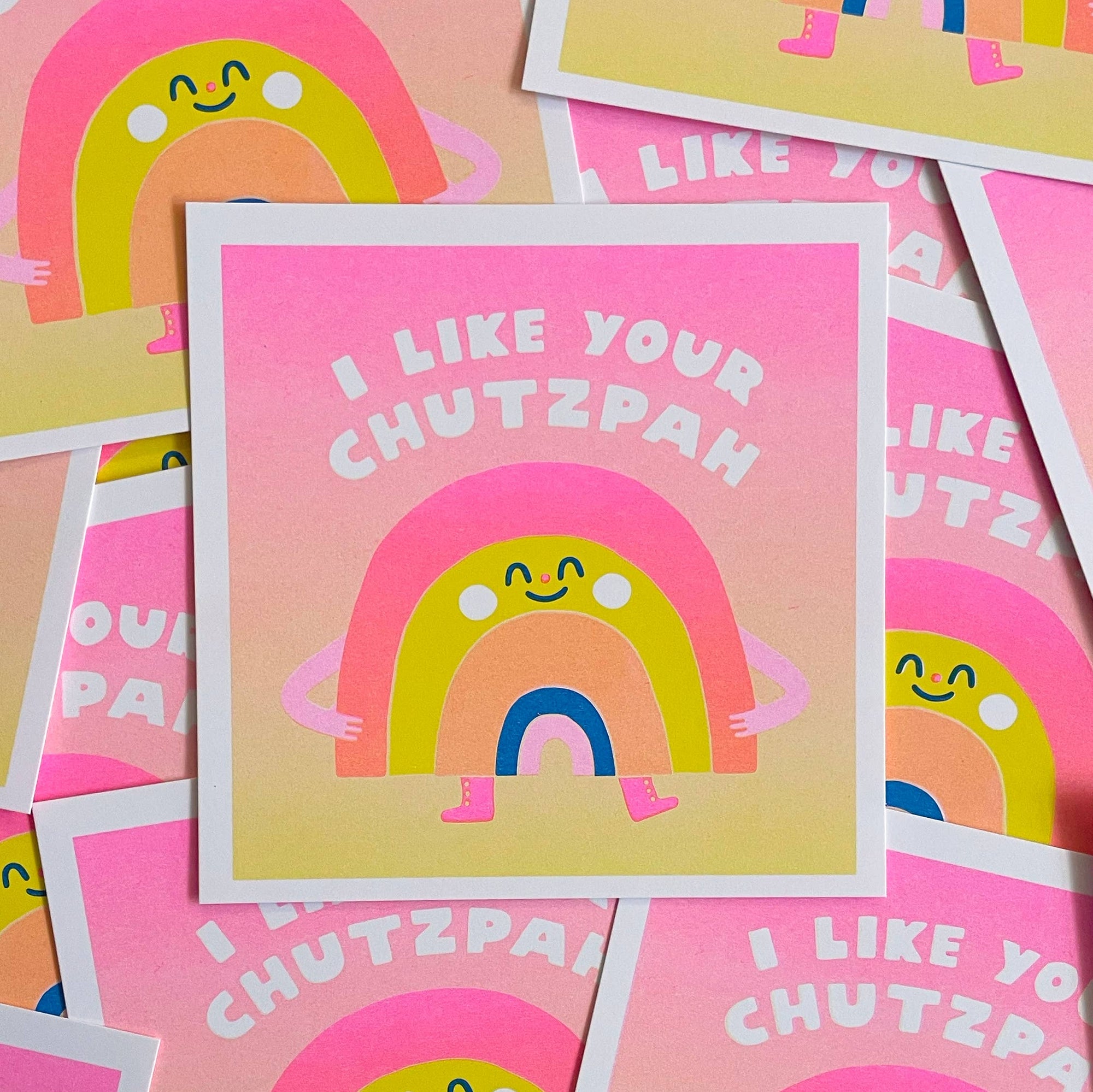 Colorful greeting cards with rainbow design and text on a pink background