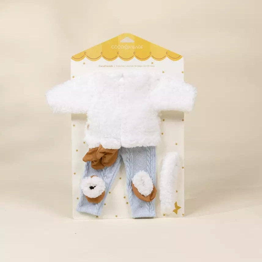 doll outfit with white sweater, blue pants, and brown shoes on a beige background