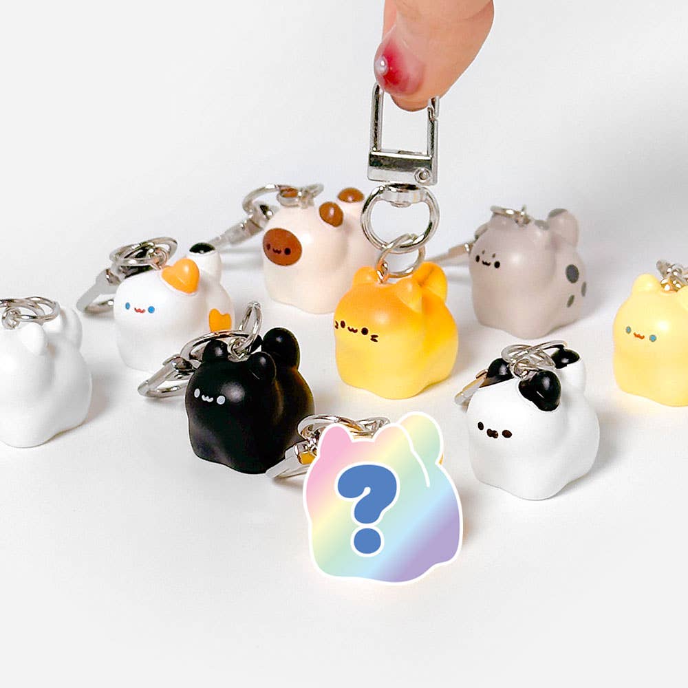 Collection of cute animal-themed keychains on a white background