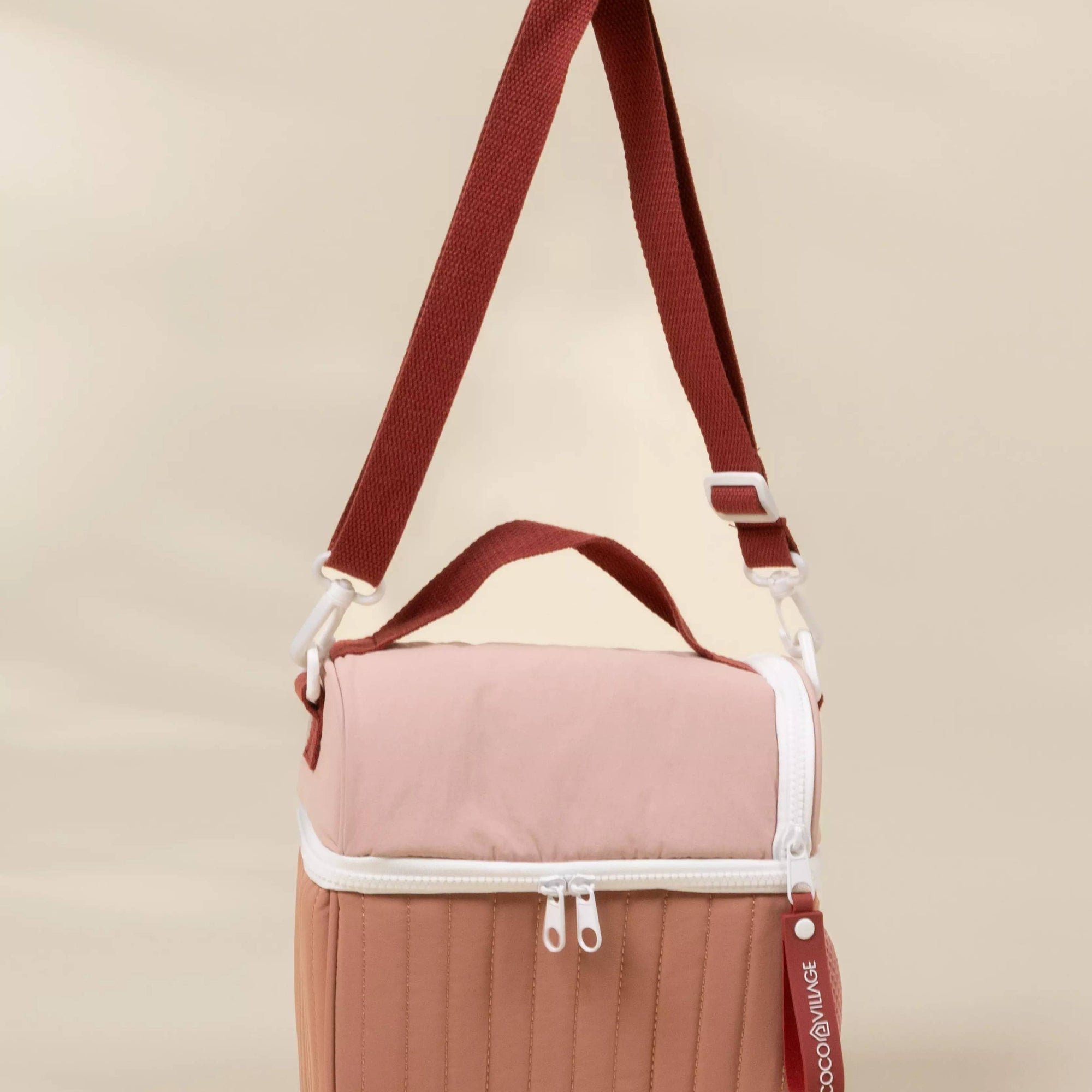 Multicolored bag with a strap on a beige background