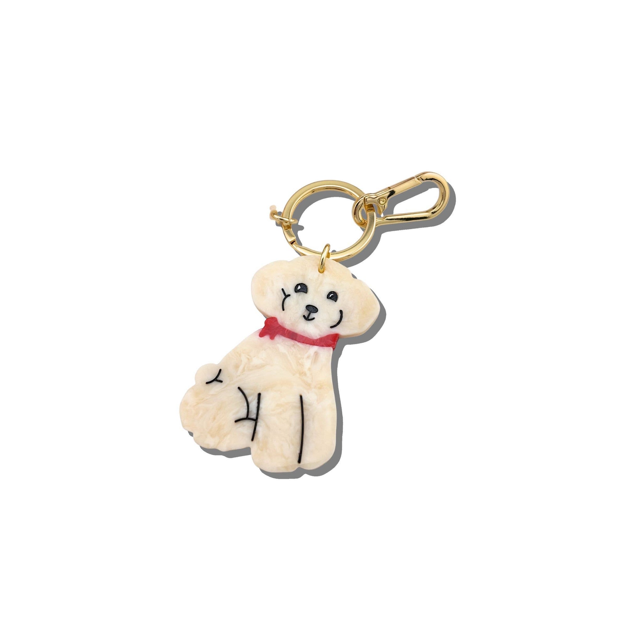 Dog-shaped keychain with a red collar on a white background