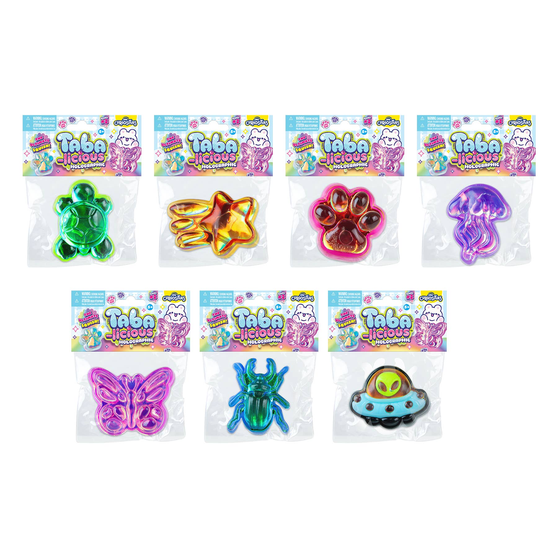 Set of colorful Tabalicious toys in packaging on a white background