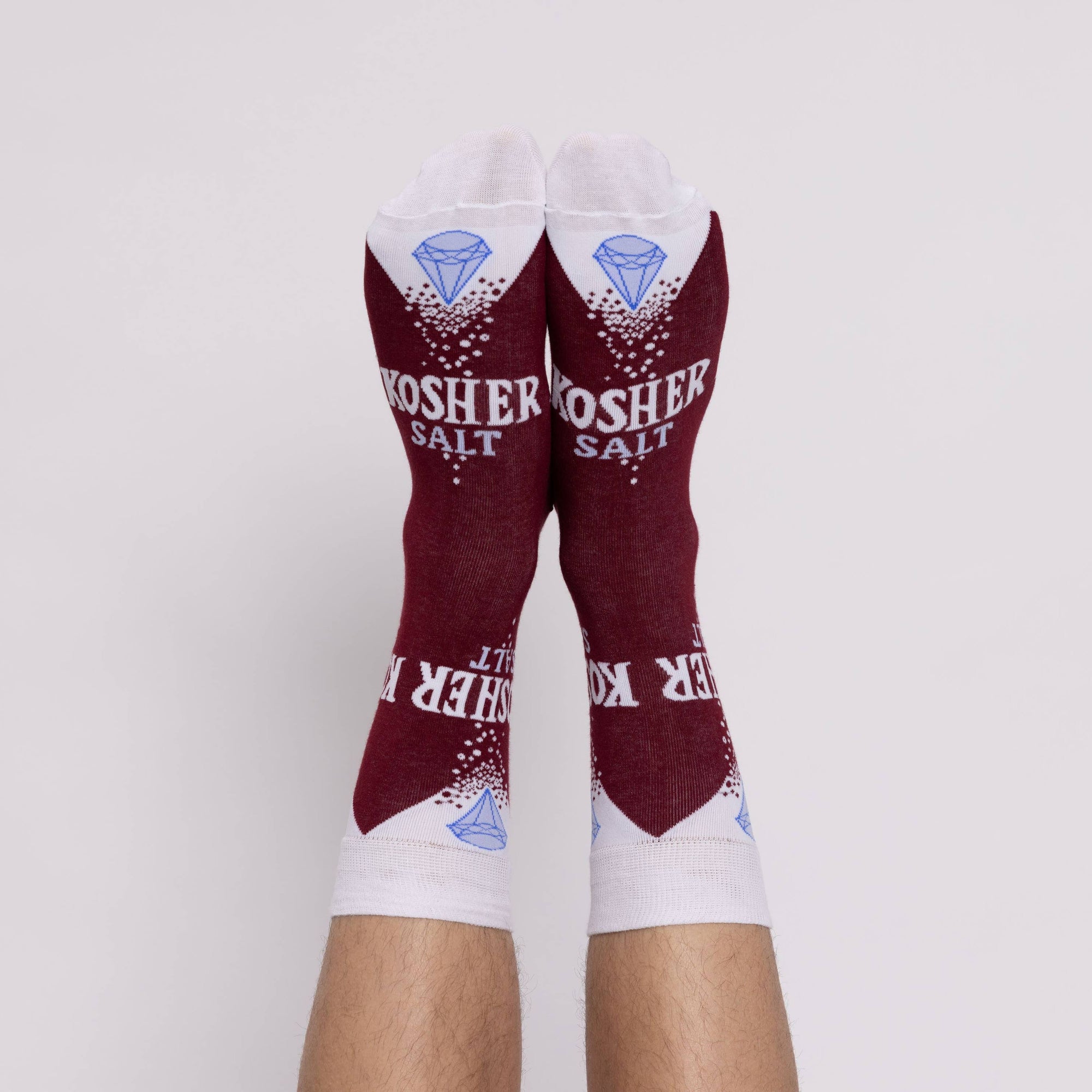 Maroon and white socks with 'Kosher Salt' text on a white background