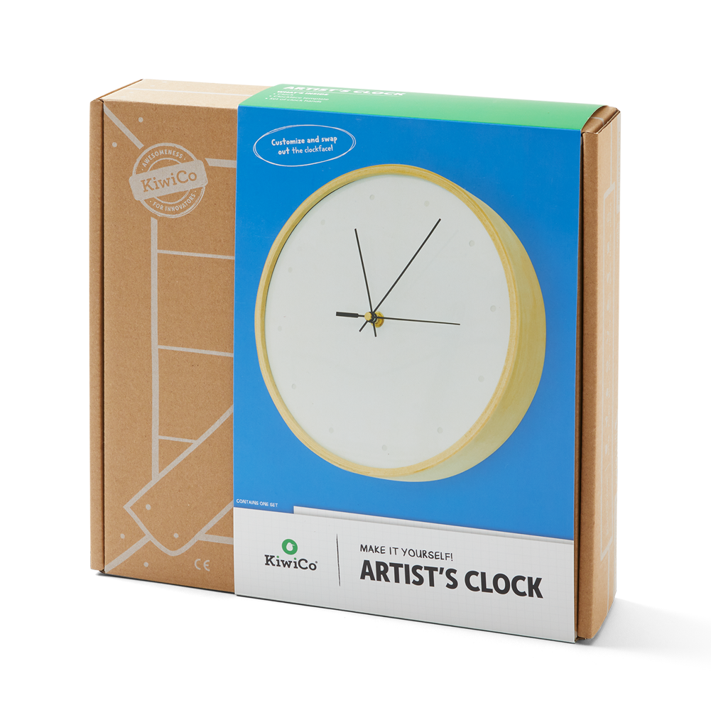 KiwiCo Artist's Clock in its retail packaging, featuring a brown cardboard box with a blue and white front label showing the clock design.