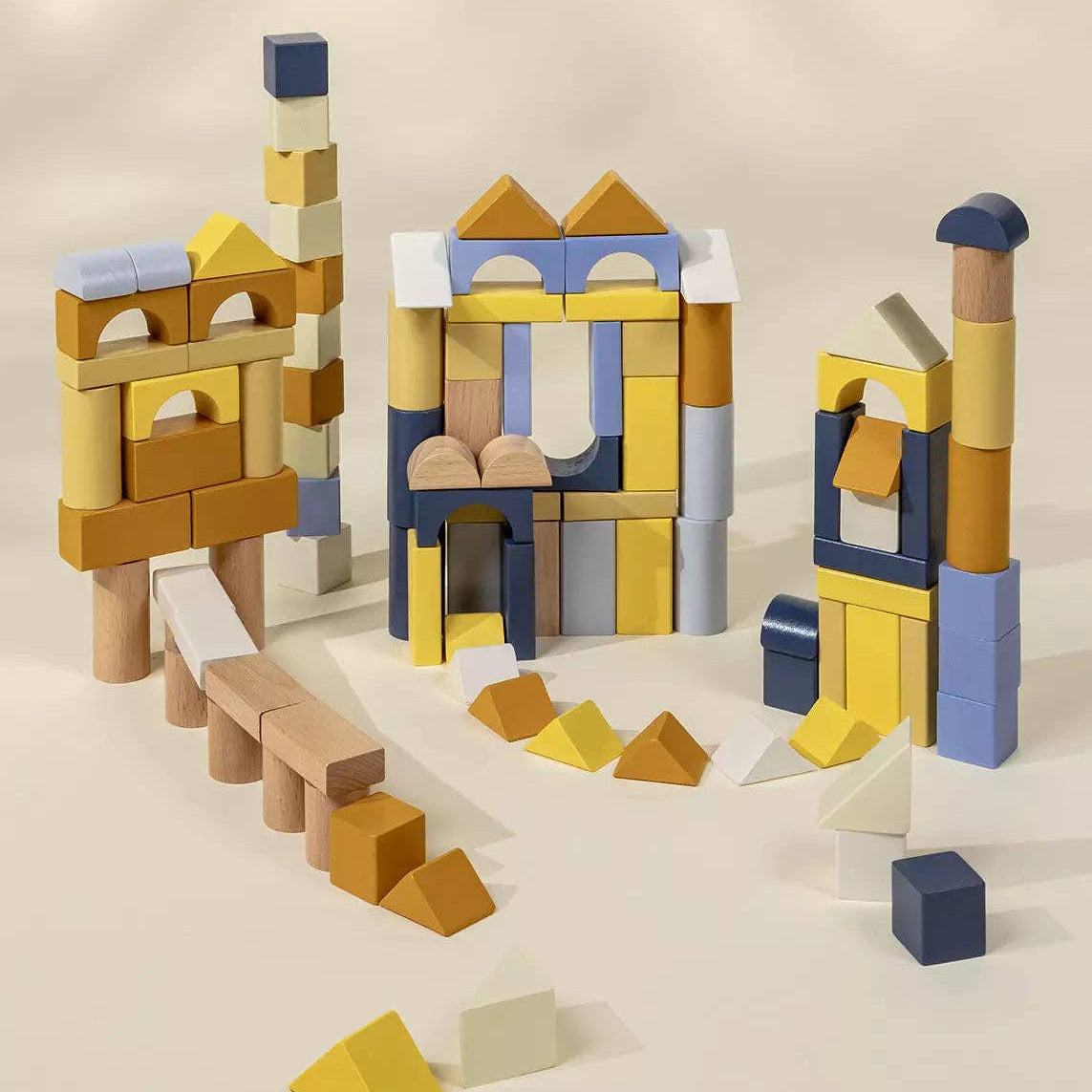 Colorful wooden building blocks on a beige background