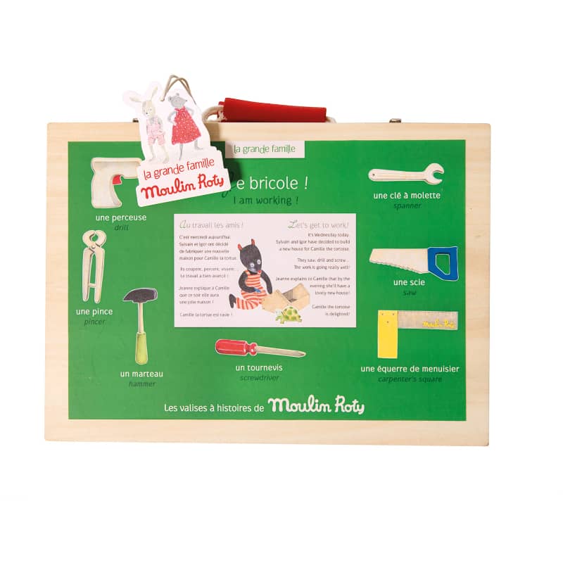 Toy tool set with educational illustrations on a green board, featuring Moulin Roty branding.