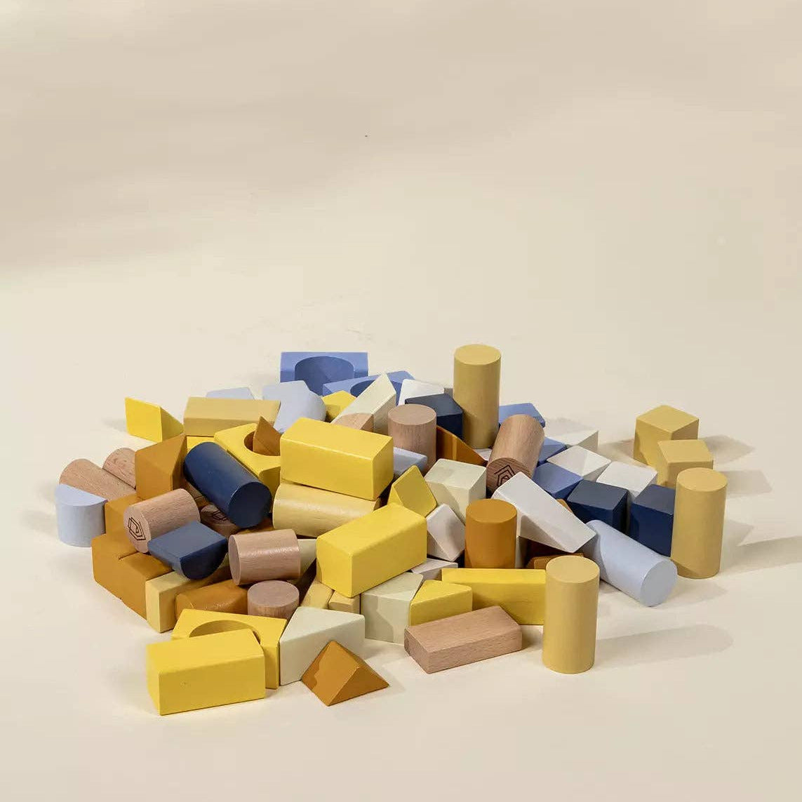 Colorful wooden blocks on a beige background